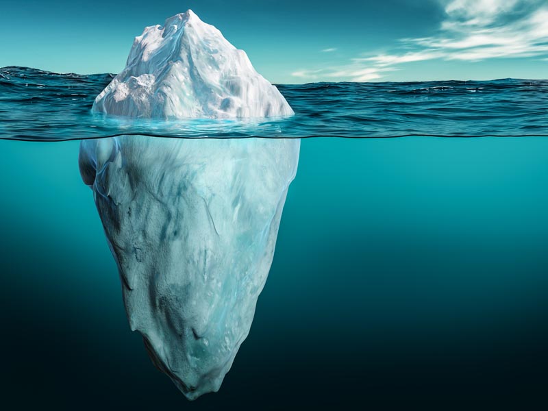 Image of iceberg lurking below the water.