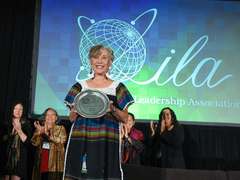 Photo showing legacy award being awarded to Juana Bordas