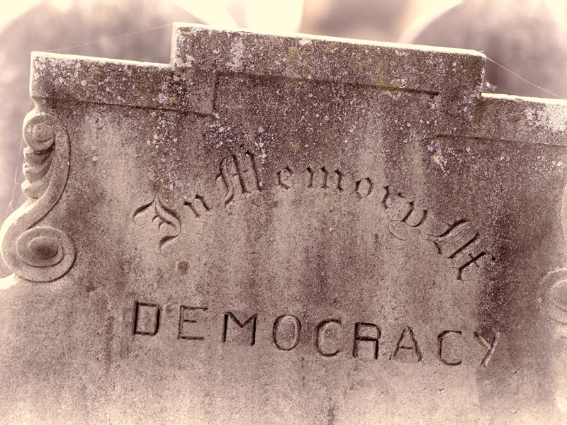 In Memory of Democracy inscribed on a headstone