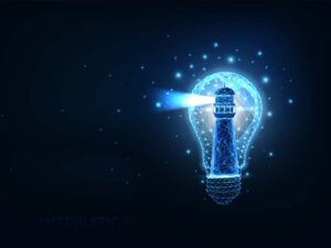 lighthouse emitting blue light inside a lightbulb against a black background.