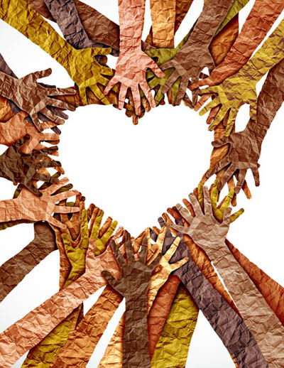 Photo of paper arms and hands forming a heart.